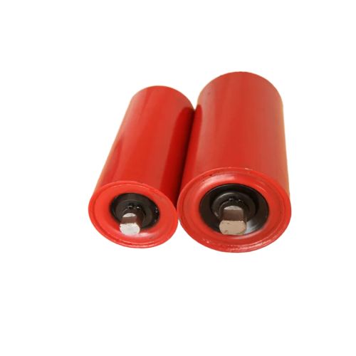 Technician cleaning and lubricating a CEMA conveyor idler to ensure proper maintenance